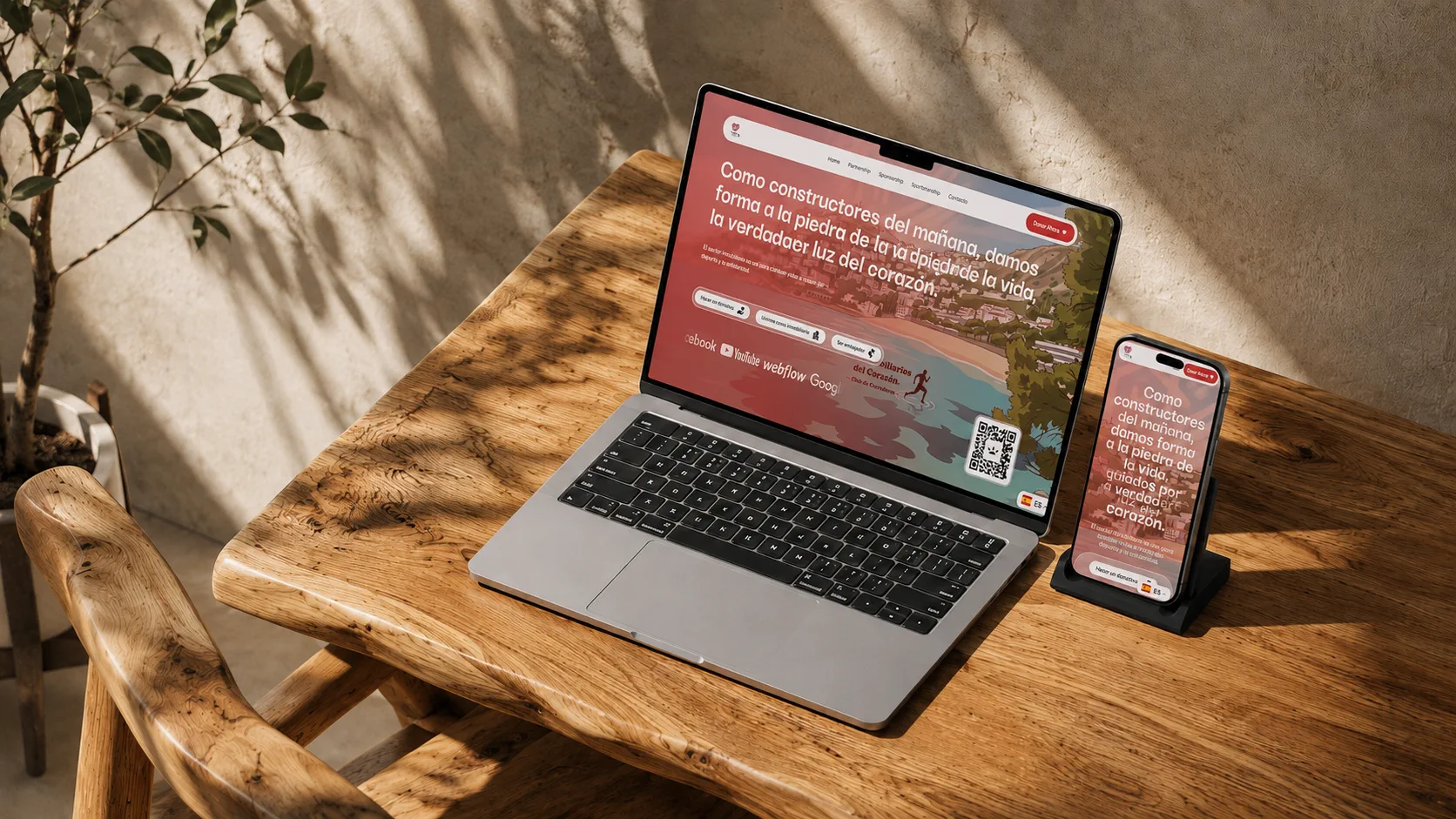 Proyecto web de Los Inmobiliarios del Corazón en notebook y teléfono